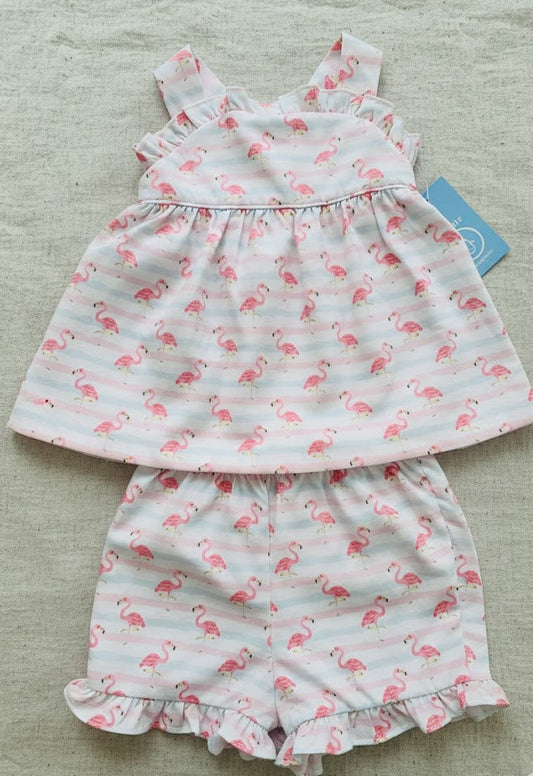 Children's dress and bloomers set with flamingo pattern on a light background