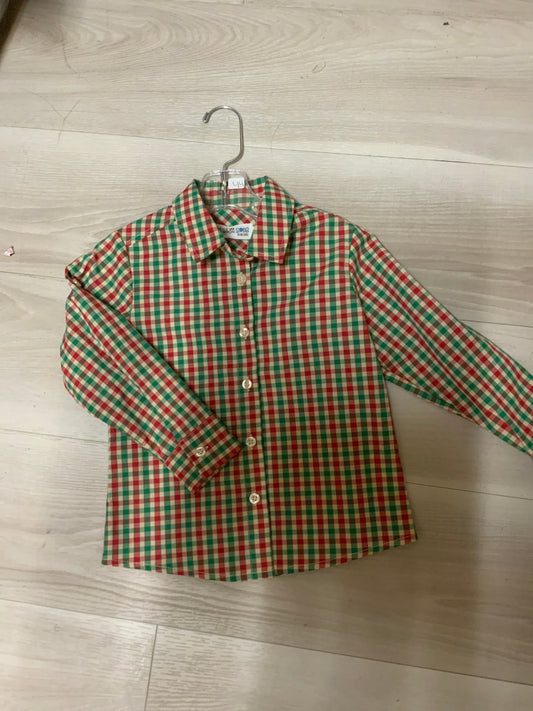 A red and green plaid long sleeve button up shirt for boys.