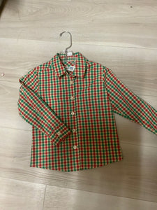 A red and green plaid long sleeve button up shirt for boys.